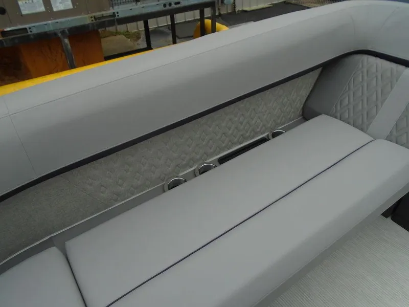Slide: The Image of 2025 Bennington M Swingback 24 MSB boat interior with gray quilted seating. - 21