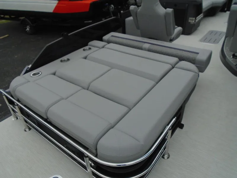 Slide: The Image of 2025 Bennington M Swingback 24 MSB boat with gray cushioned seating. - 27
