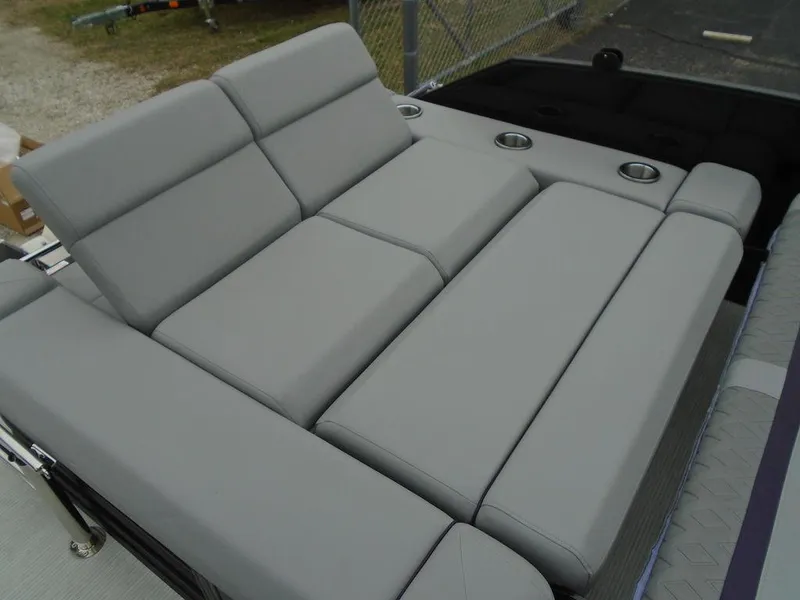 Slide: The Image of 2025 Bennington M Swingback 24 MSB boat seating with gray upholstery and cup holders. - 28