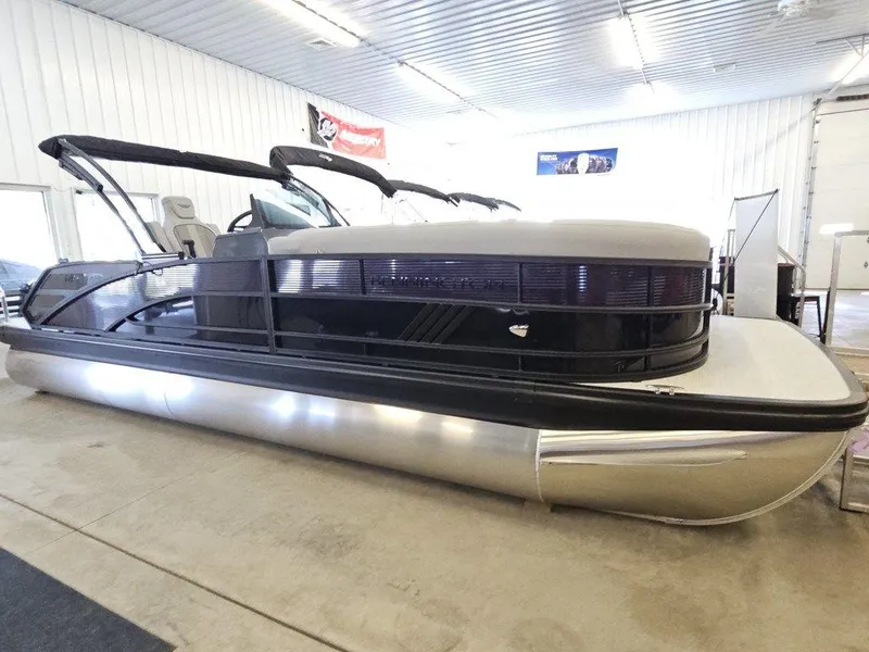 Slide: The Image of 2025 Bennington M Swingback 24 MSB pontoon boat in indoor showroom. - 3