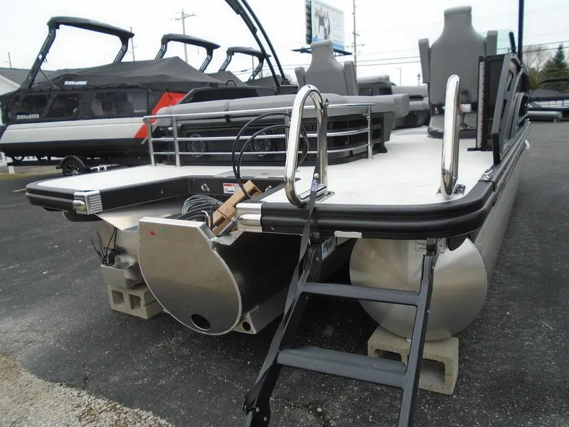 Slide: The Image of 2025 Bennington M Swingback 24 MSB pontoon boat, rear view with ladder and seating. - 34
