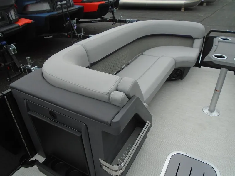 Slide: The Image of 2025 Bennington M Swingback 24 MSB boat interior with gray seating and cup holders. - 7
