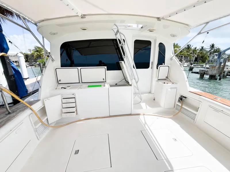 Slide: The Image of 2002 Ocean Yachts 48 Super Sport cockpit with storage, seating, and ocean view. - 10