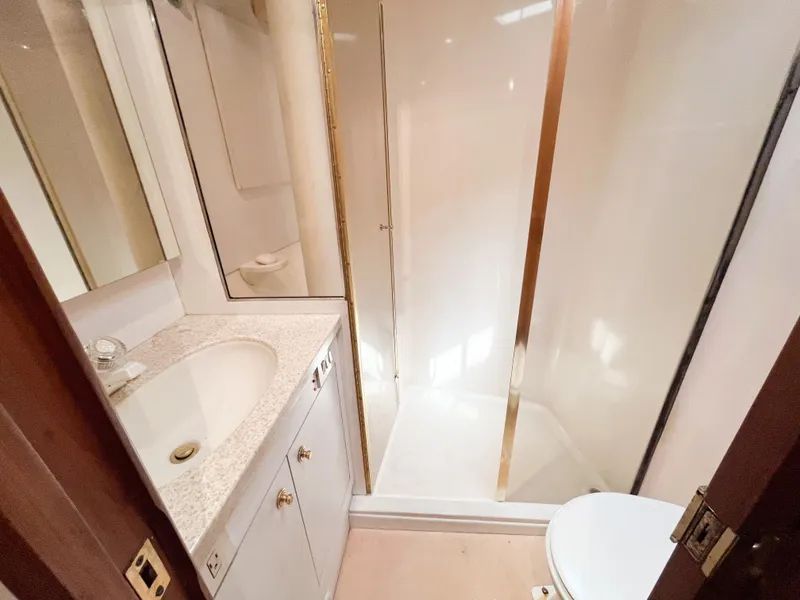 Slide: The Image of Bathroom interior of 2002 Ocean Yachts 48 Super Sport with shower and vanity. - 16