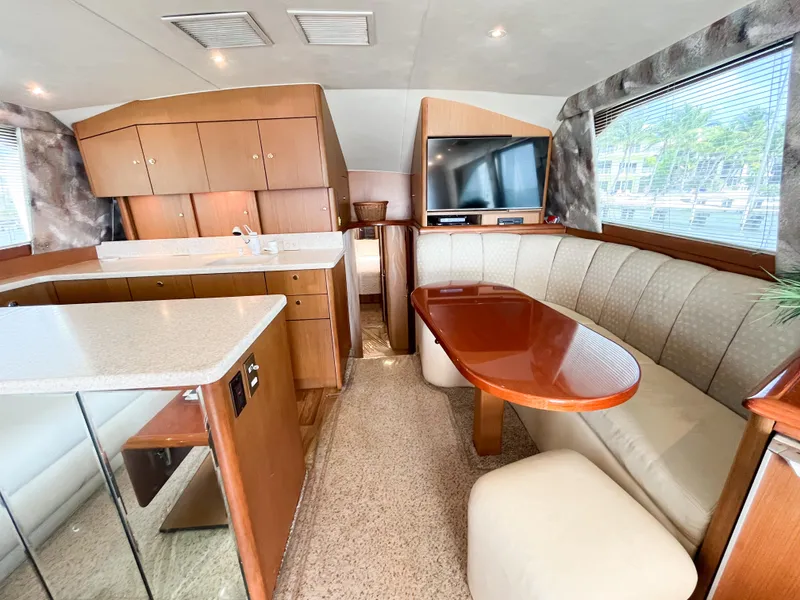 Slide: The Image of Luxurious interior of 2002 Ocean Yachts 48 Super Sport with dining area and modern amenities. - 18