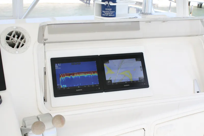 Slide: The Image of Dual Garmin displays on 2002 Ocean Yachts 48 Super Sport dashboard. - 29