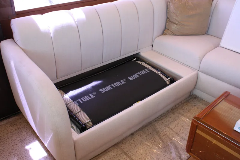 Slide: The Image of 2002 Ocean Yachts 48 Super Sport interior with hidden storage under sofa. - 31