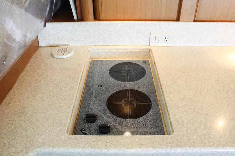 Slide: The Image of 2002 Ocean Yachts 48 Super Sport kitchen with built-in electric stove. - 39