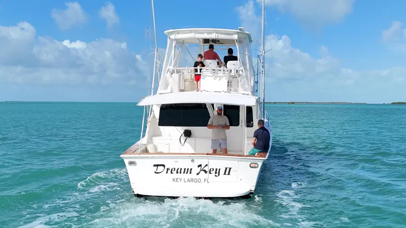 Slide: The Image of Ocean Yachts 2002 48 Super Sport boat, "Dream Key II," cruising in clear blue waters. - 4