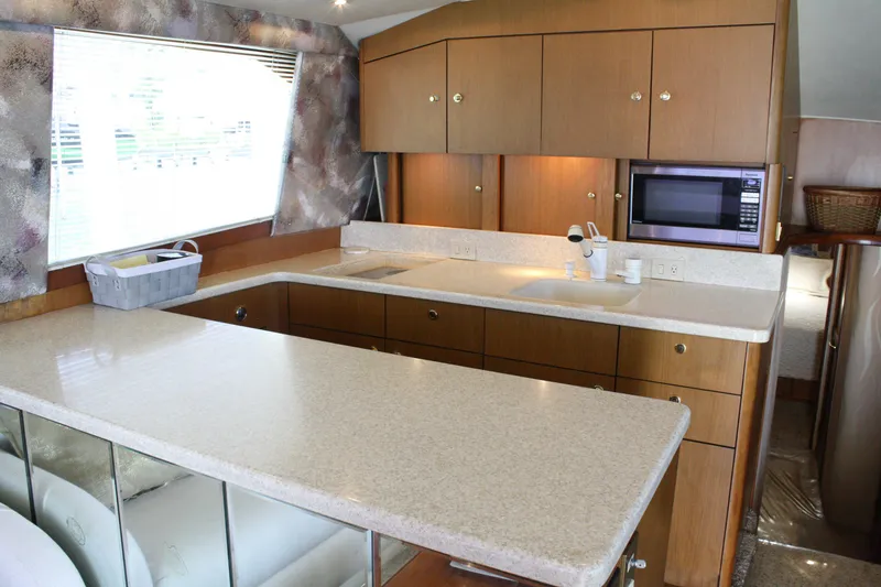 Slide: The Image of Luxurious kitchen interior of 2002 Ocean Yachts 48 Super Sport with modern amenities. - 40