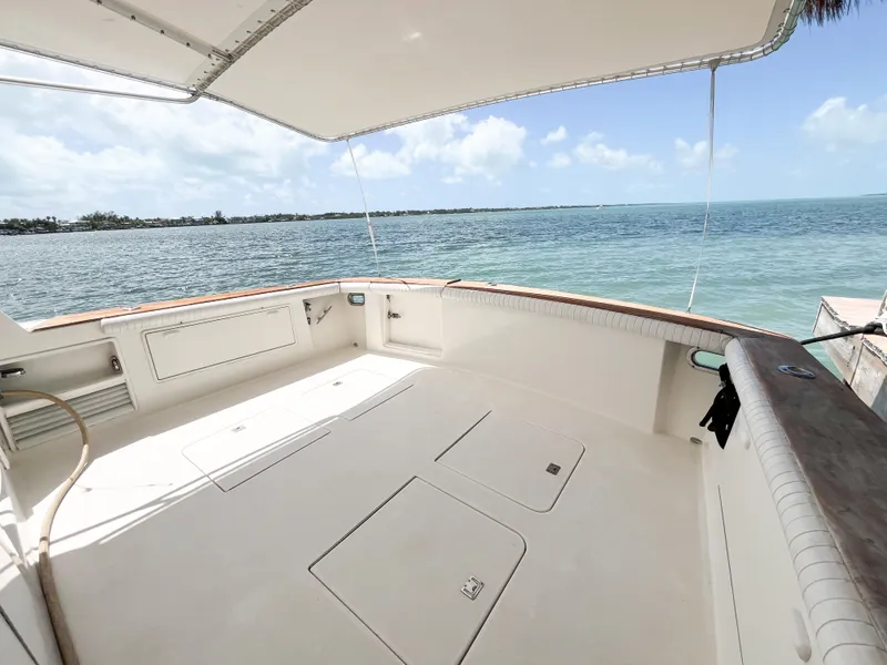 Slide: The Image of 2002 Ocean Yachts 48 Super Sport deck with ocean view under canopy. - 8