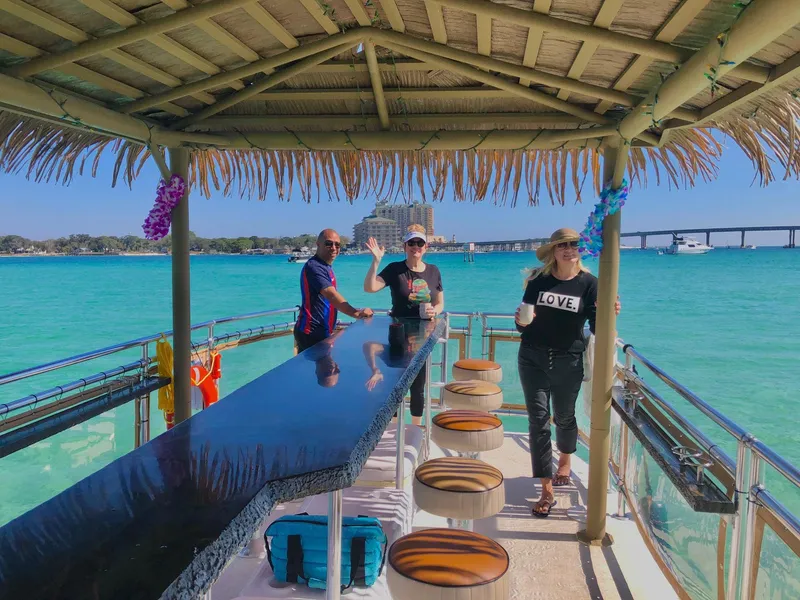 Slide: The Image of Three people enjoying a sunny day on a 2022 Beachcat COI Tiki Boat. - 13
