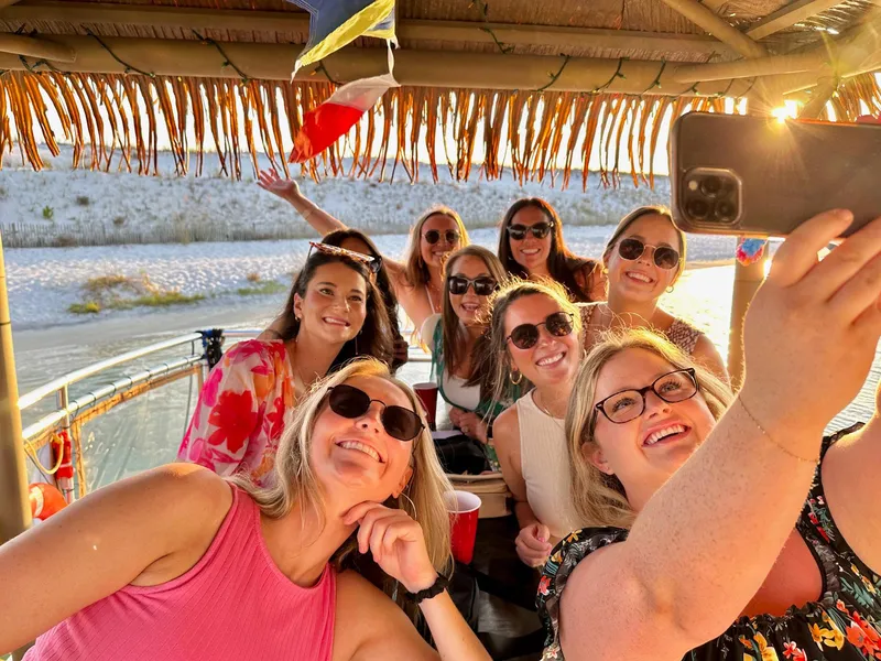 Slide: The Image of Group of friends taking a selfie on a 2022 Beachcat COI Tiki Boat. - 19
