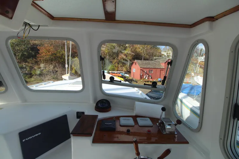 Slide: The Image of Interior view of 2020 Holland 32 boat cockpit with control panel and windows. - 19