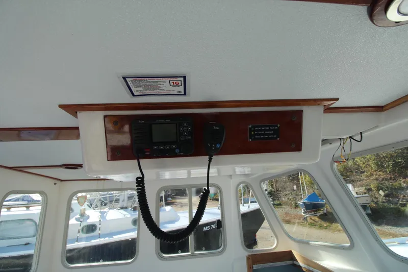 Slide: The Image of Interior of a 2020 Holland 32 boat with radio equipment and windows. - 20
