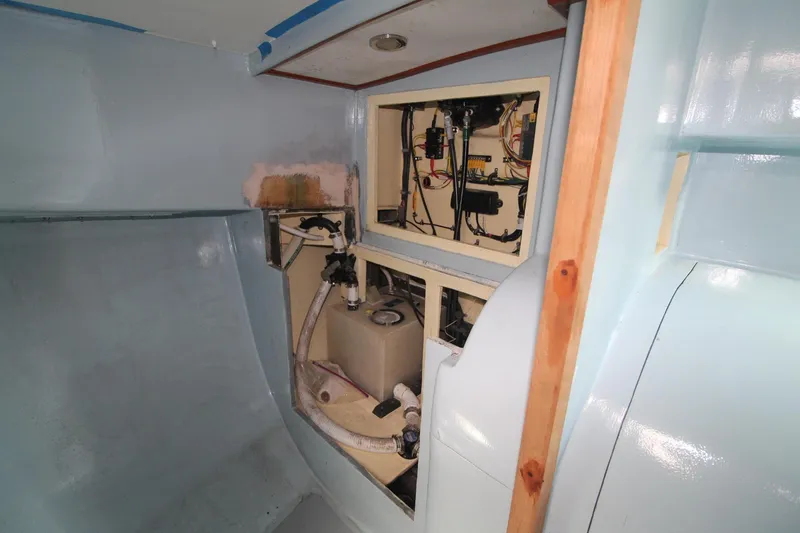 Slide: The Image of Interior view of a 2020 Holland 32 boat, showcasing wiring and equipment. - 22