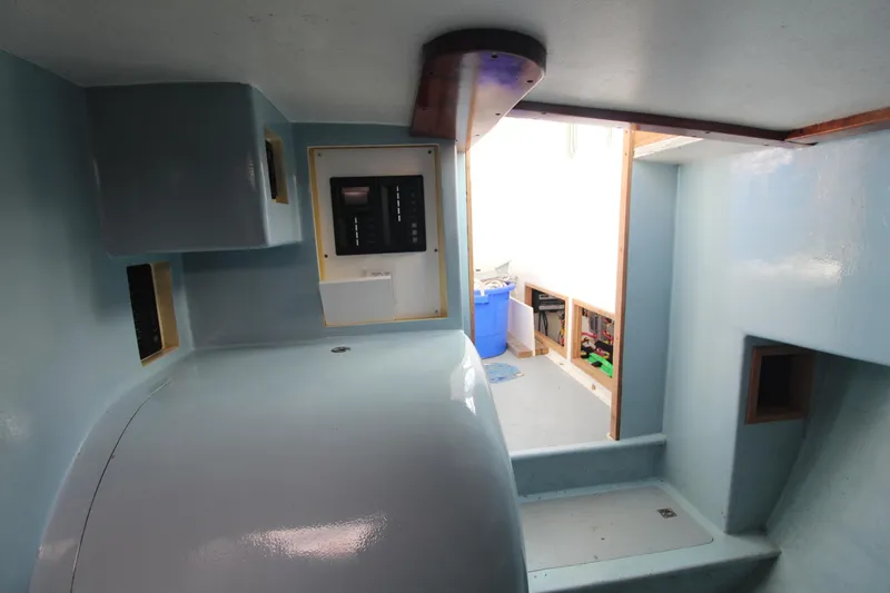 Slide: The Image of Interior of a 2020 Holland 32 boat, featuring sleek design and modern amenities. - 24