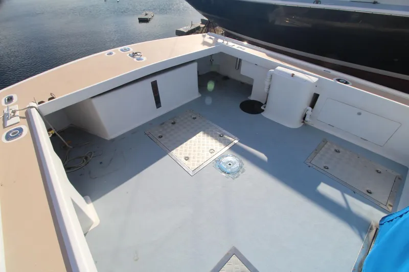 Slide: The Image of Spacious deck of 2020 Holland 32 boat, featuring storage hatches and clean design. - 7