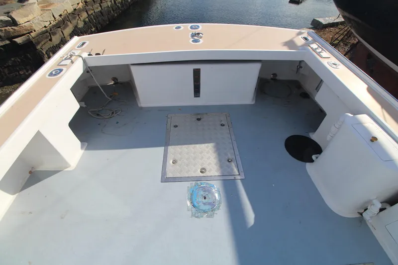 Slide: The Image of Open deck of a 2020 Holland 32 boat, featuring spacious layout and utility fixtures. - 8