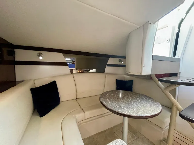 Slide: The Image of Interior of 2012 Cruisers Yachts 35 Express with cozy seating and round table. - 11