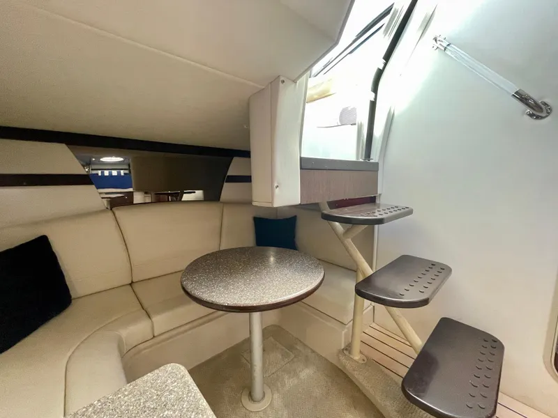 Slide: The Image of Interior of 2012 Cruisers Yachts 35 Express with seating and table. - 12