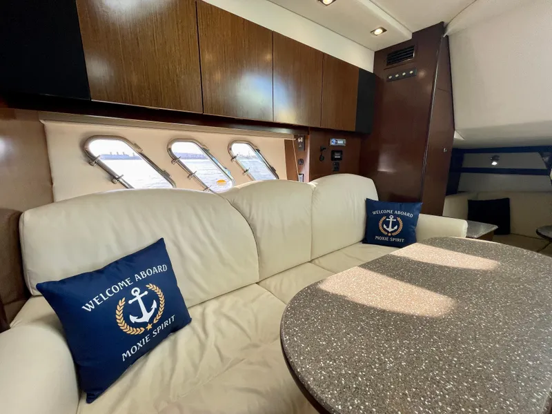 Slide: The Image of Luxurious interior of 2012 Cruisers Yachts 35 Express with plush seating and nautical decor. - 15