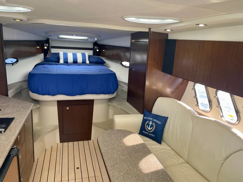 Slide: The Image of Luxurious 2012 Cruisers Yachts 35 Express interior with cozy bed and elegant seating area. - 18
