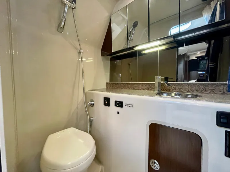 Slide: The Image of 2012 Cruisers Yachts 35 Express bathroom with shower, sink, and mirror. - 24
