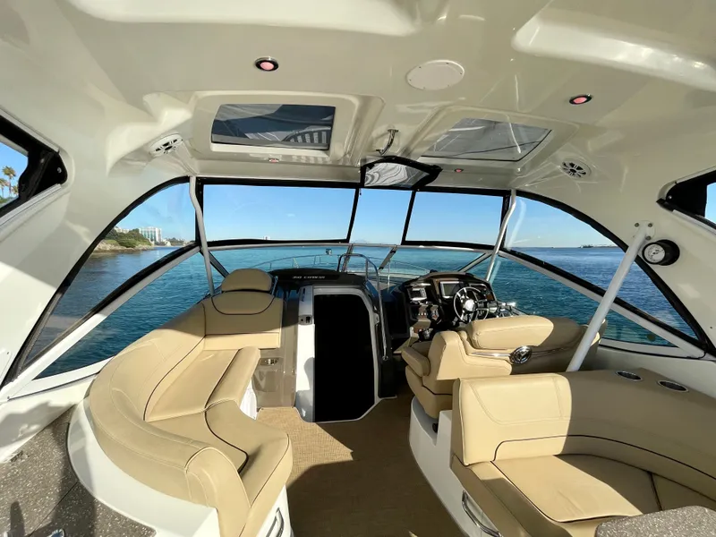 Slide: The Image of Interior of 2012 Cruisers Yachts 35 Express, featuring luxurious seating and panoramic windows. - 36