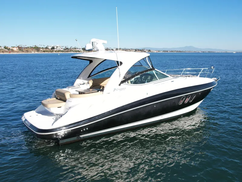 Slide: The Image of 2012 Cruisers Yachts 35 Express on calm blue water, side view. - 4