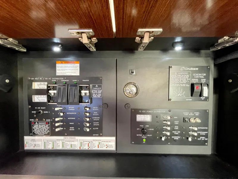 Slide: The Image of Electrical control panel of 2012 Cruisers Yachts 35 Express, featuring switches and indicators. - 47