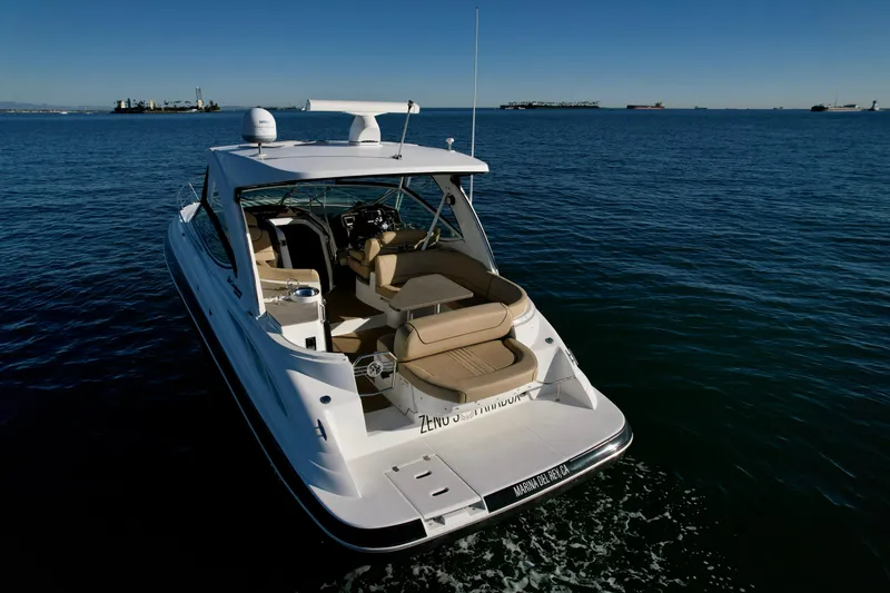 Slide: The Image of 2012 Cruisers Yachts 35 Express on open water, rear view. - 6