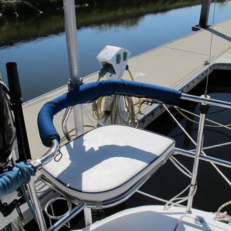 Slide: The Image of Catalina 387 sailboat stern with cushioned seat, docked at marina, 2007 model. - 11