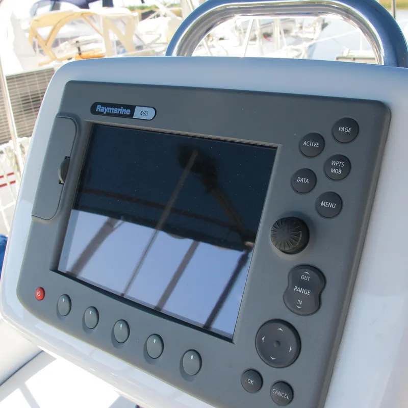 Slide: The Image of Raymarine navigation system on 2007 Catalina 387 sailboat, featuring control buttons and display. - 12