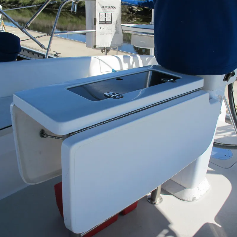 Slide: The Image of Catalina 387 sailboat cockpit sink, 2007 model, with folding table and stainless steel basin. - 18