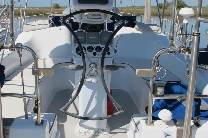 Slide: The Image of Cockpit of 2007 Catalina 387 sailboat with steering wheel and navigation instruments. - 22