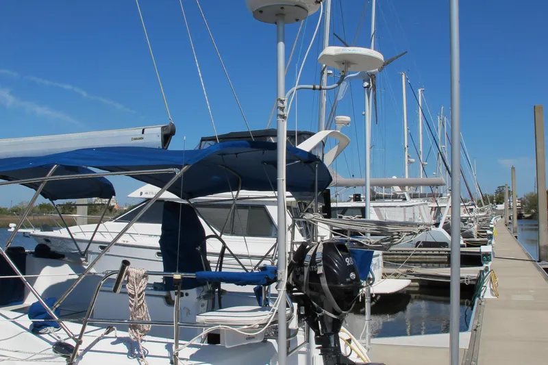 Slide: The Image of Sailboats docked at a marina, featuring a 2007 Catalina 387. - 23