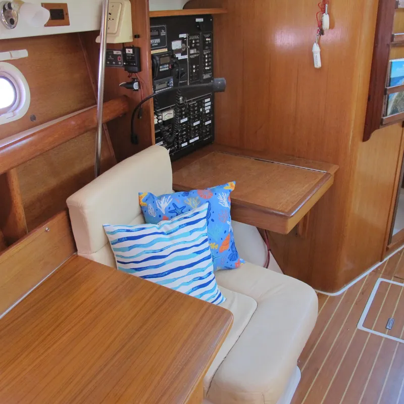Slide: The Image of Interior of a 2007 Catalina 387 sailboat with seating and control panel. - 25