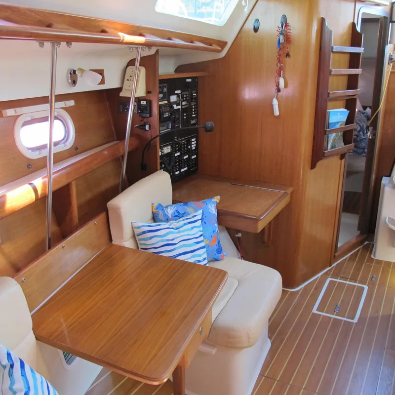 Slide: The Image of Interior of 2007 Catalina 387 sailboat with wooden furnishings and seating area. - 29