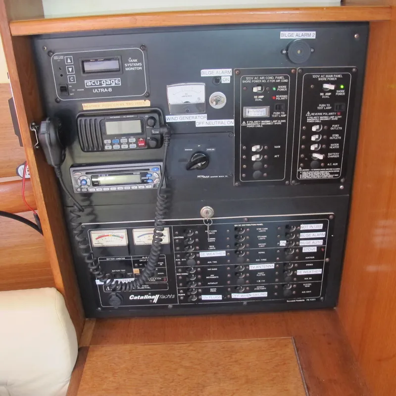 Slide: The Image of Electrical control panel of a 2007 Catalina 387 sailboat with various switches and gauges. - 31