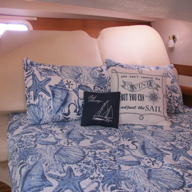 Slide: The Image of Cozy cabin interior of 2007 Catalina 387 with nautical-themed bedding and decorative pillows. - 43