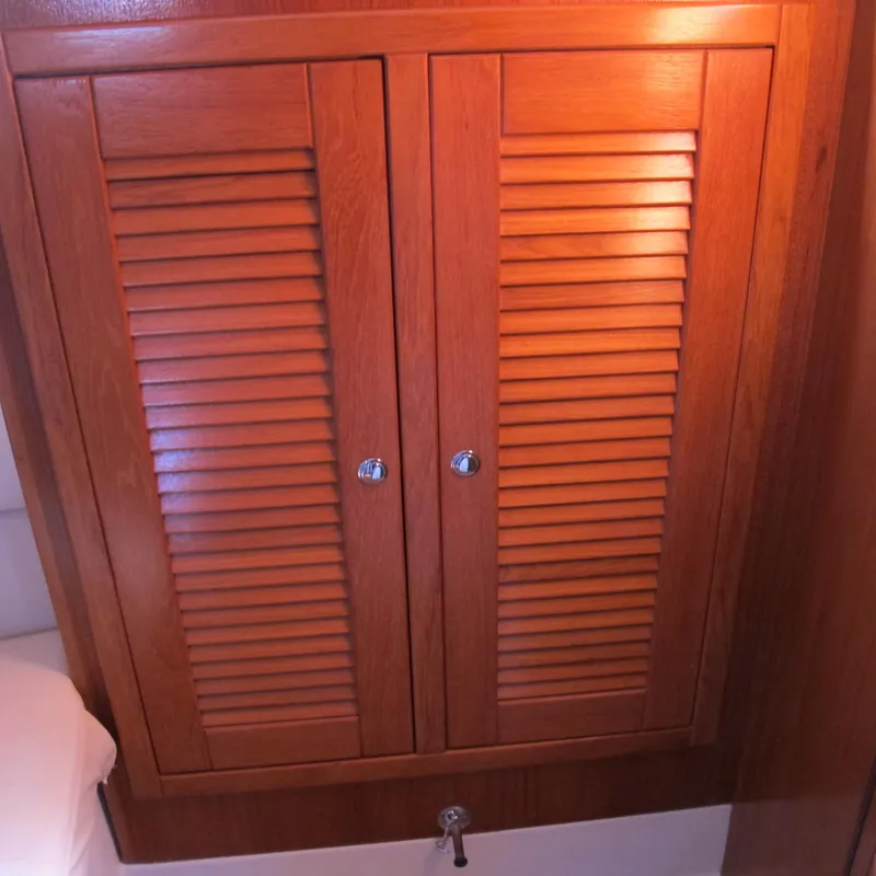 Slide: The Image of Wooden louvered cabinet doors on a 2007 Catalina 387 yacht interior. - 45