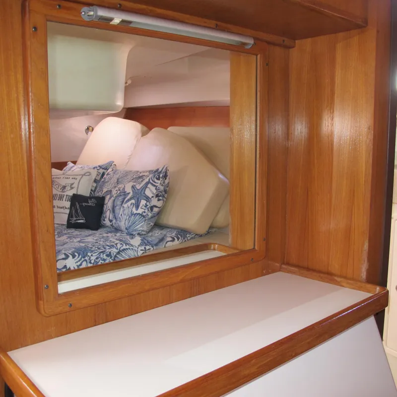 Slide: The Image of Interior of 2007 Catalina 387 yacht with wooden finish and cozy bedding. - 46