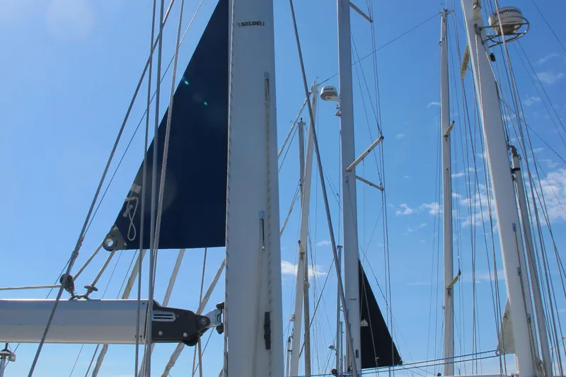 Slide: The Image of Sailboat masts and rigging of a 2007 Catalina 387 against a clear blue sky. - 8