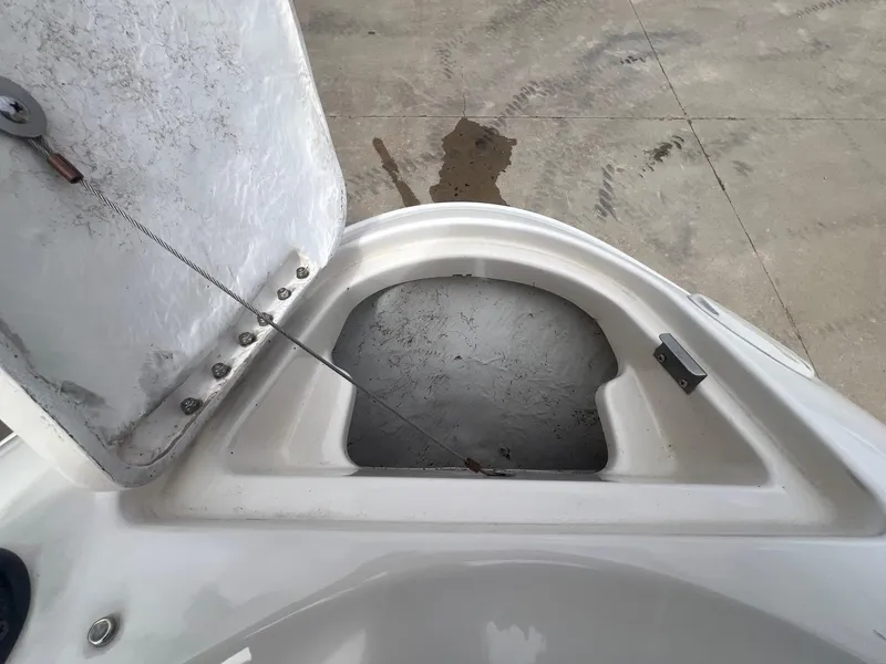 Slide: The Image of Open storage compartment on a 2002 Maxum 2300 SR boat. - 12