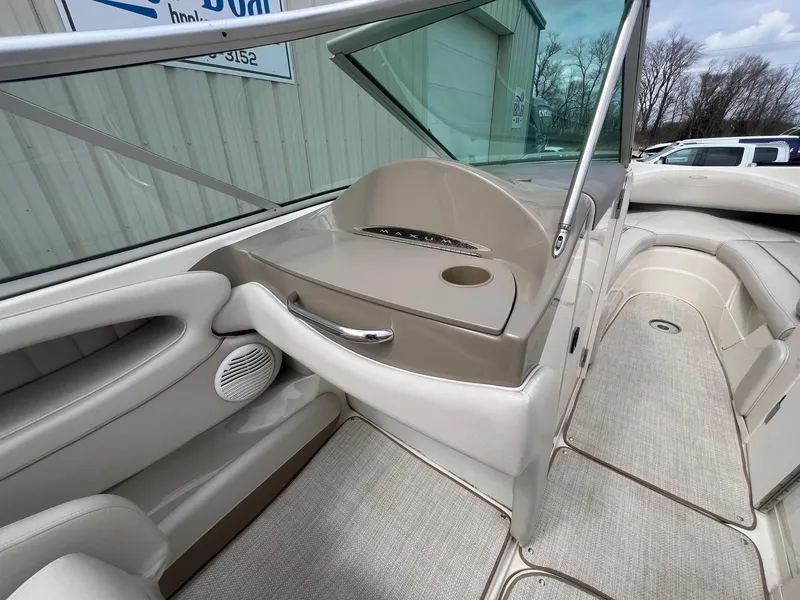 Slide: The Image of Interior of 2002 Maxum 2300 SR boat, featuring seating and storage areas. - 20