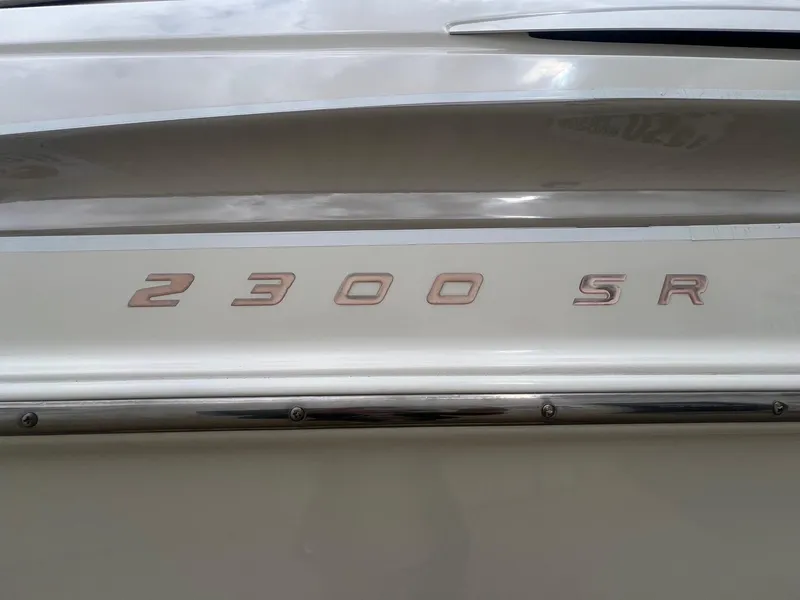 Slide: The Image of Close-up of 2002 Maxum 2300 SR boat model lettering on hull. - 3