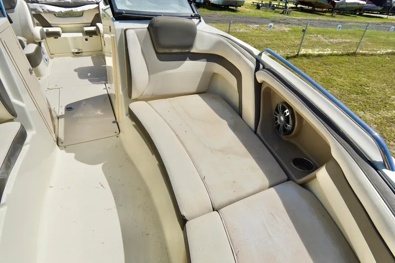 Slide: The Image of 2015 Yamaha Boats 242 Limited S interior seating with speaker and cup holder. - 12