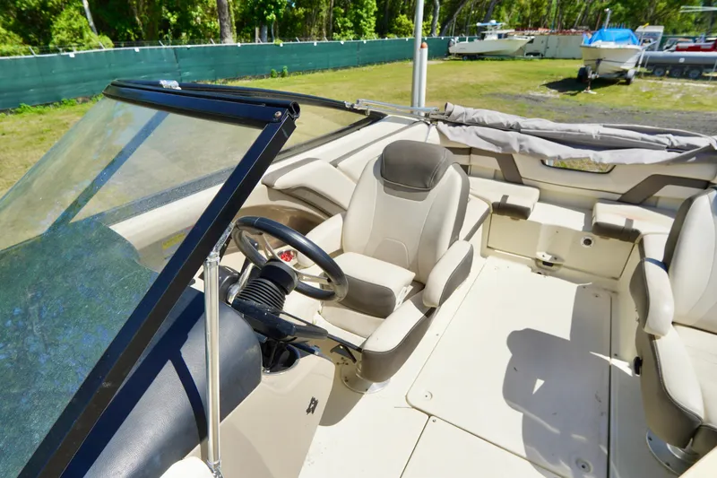 Slide: The Image of 2015 Yamaha Boats 242 Limited S interior with steering wheel and seating. - 17