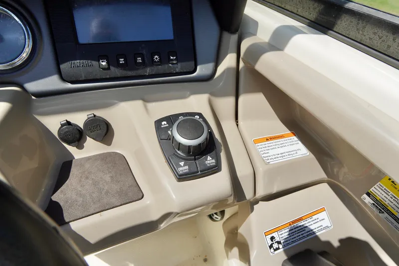 Slide: The Image of Control panel of 2015 Yamaha Boats 242 Limited S with navigation controls and display. - 20